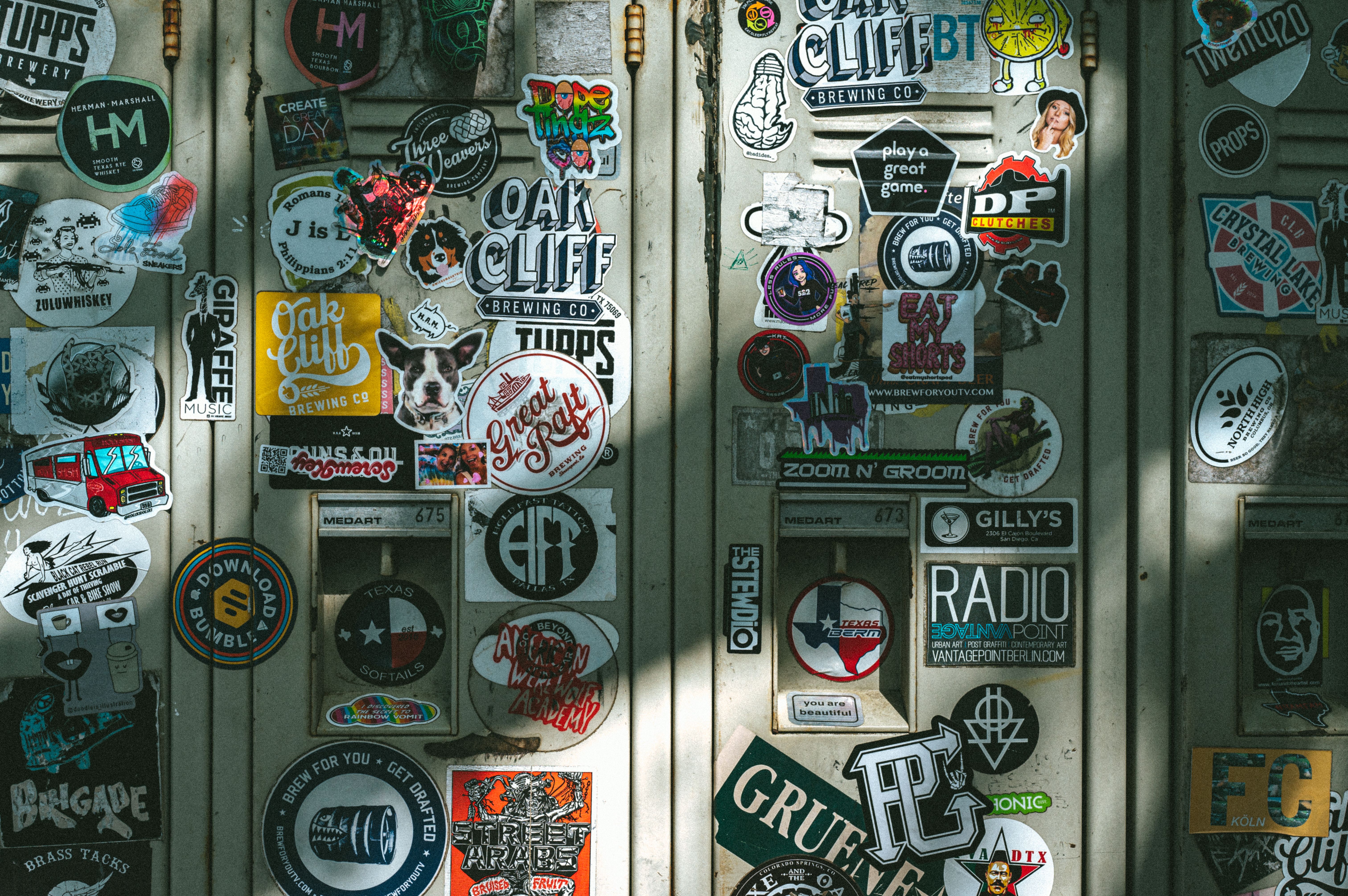 Vibrant assortment of stickers covering lockers in Dallas, Texas.