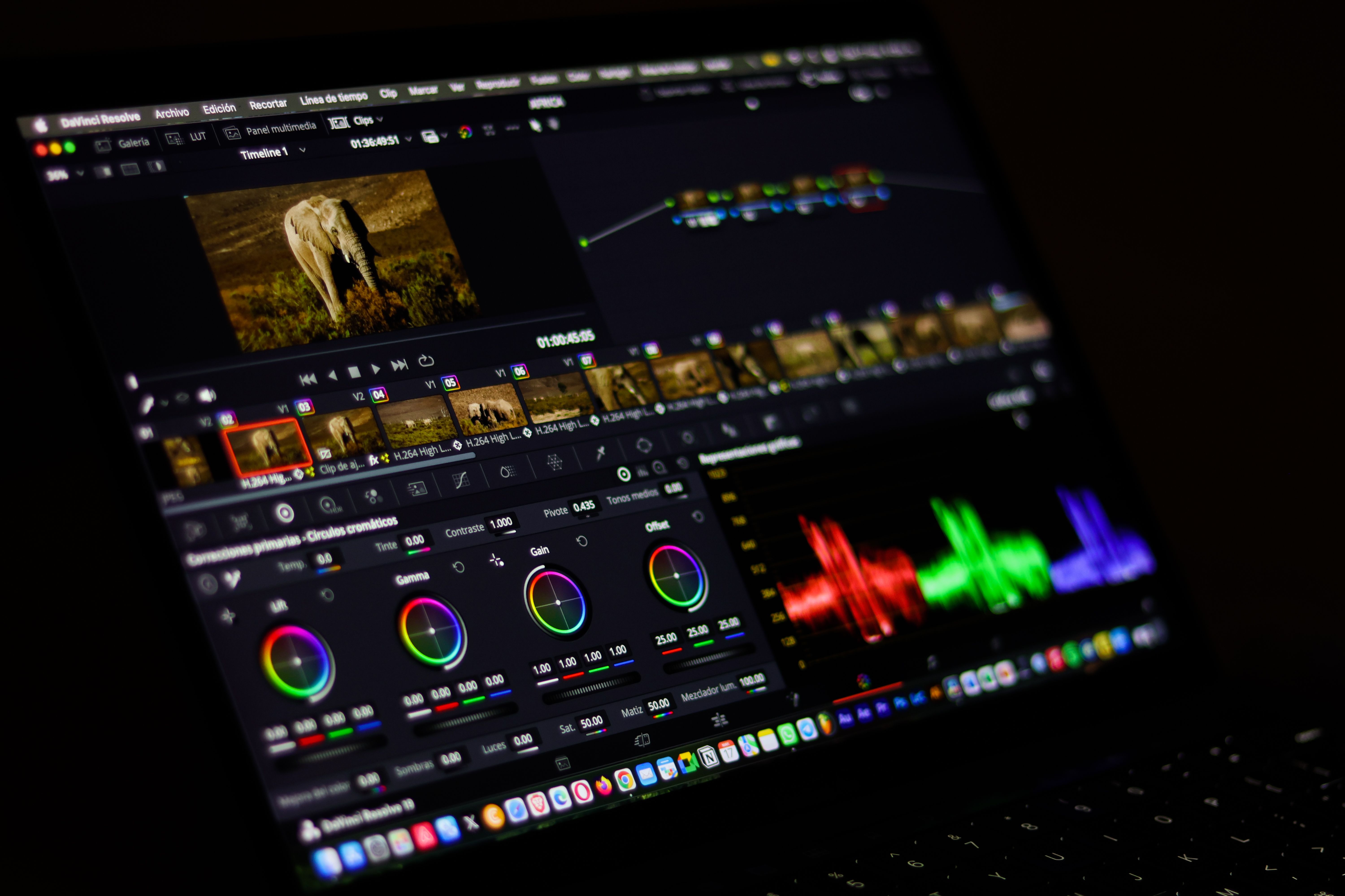 Close-up view of professional video editing software displaying colorful waveforms.
