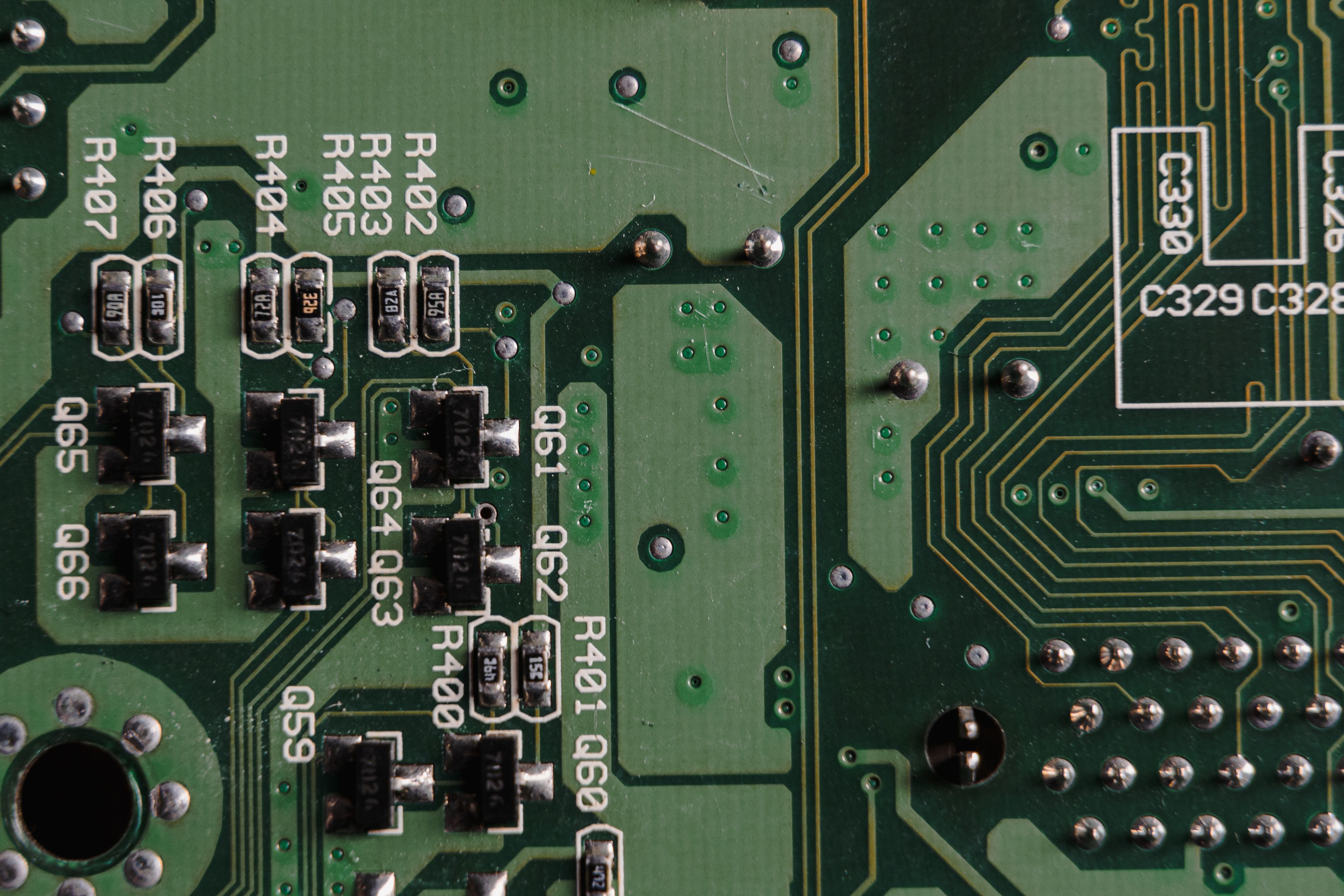 Detailed close-up view of an electronic circuit board with visible components and traces.